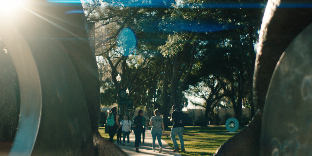 students walking on science green