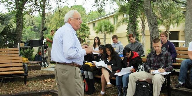 Dr. White teaching students in the outdoor classroom on campus. 