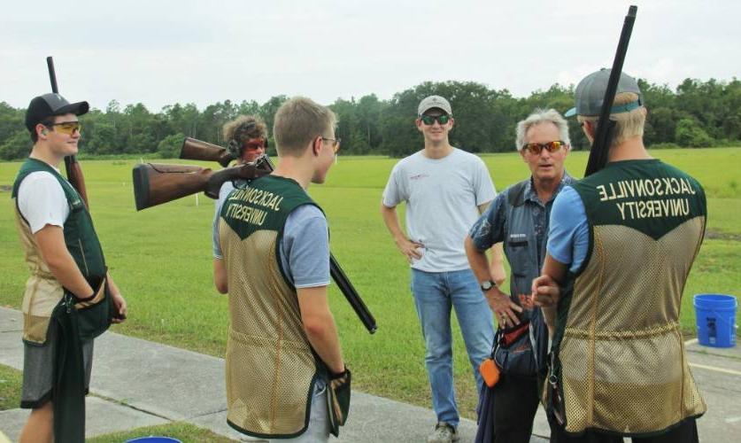 JU Students preparing to shoot listen to Coach