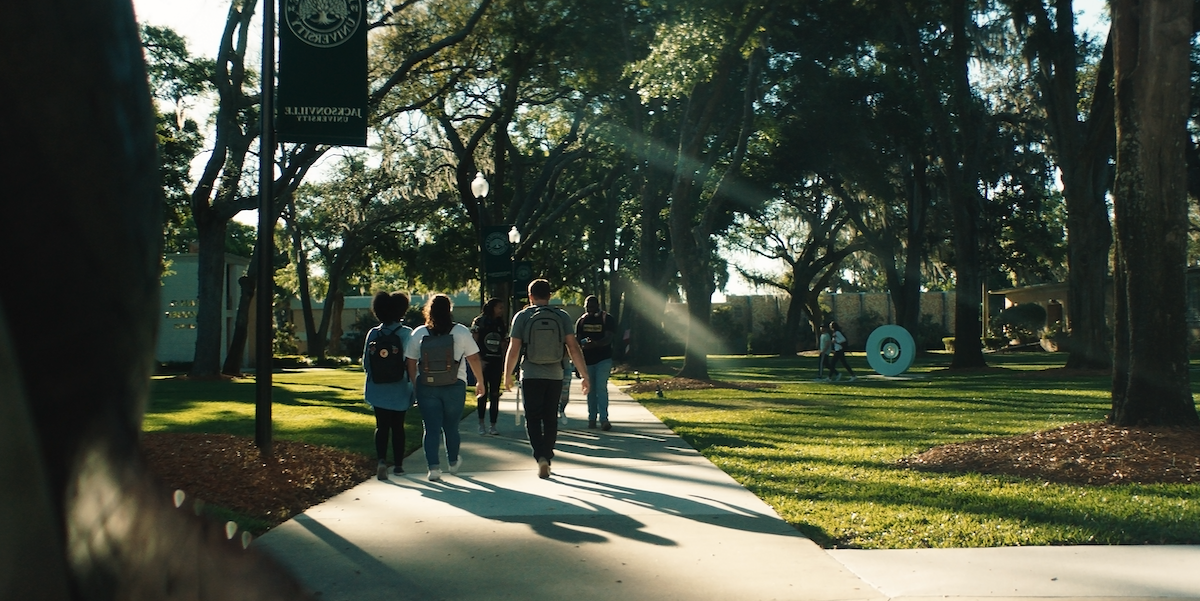 students walking through campus