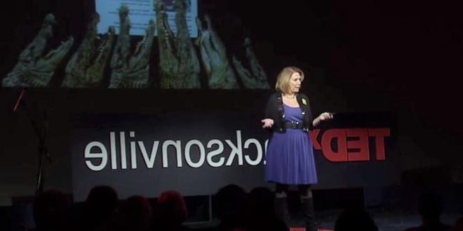 female speaker talking on stage