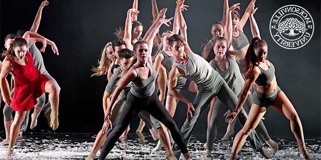 A group of student dancers performing on stage.