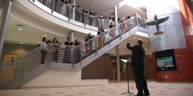 Dr. Timothy Snyder conducting Linda Berry Stein College of Fine Arts vocal students in an impromptu campus concert, A Little Lunch Music at the Davis College of Business.