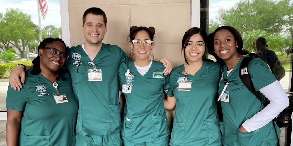 nursing students pose in between classes