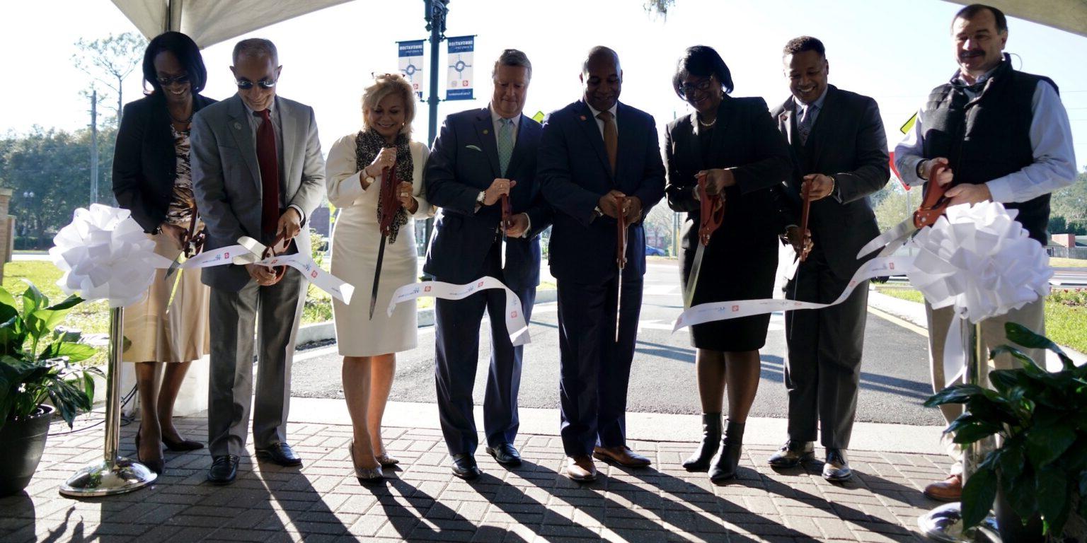 JTA CEO Nathaniel Ford and Jacksonville University President Tim Cost cut the ribbon to the roundabout alongside dignitaries.